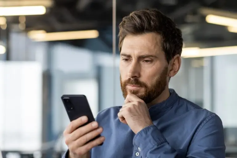 Man on Mobile Phone looking thoughtful