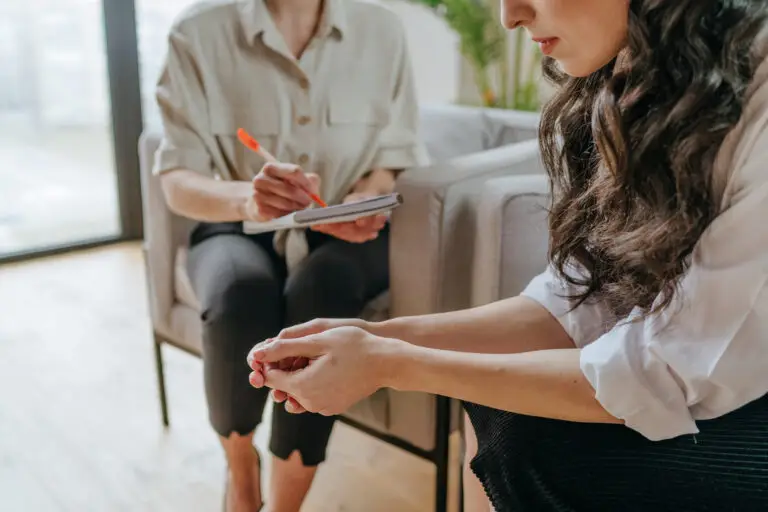 Young woman opening up about stress and burnout in a supportive setting